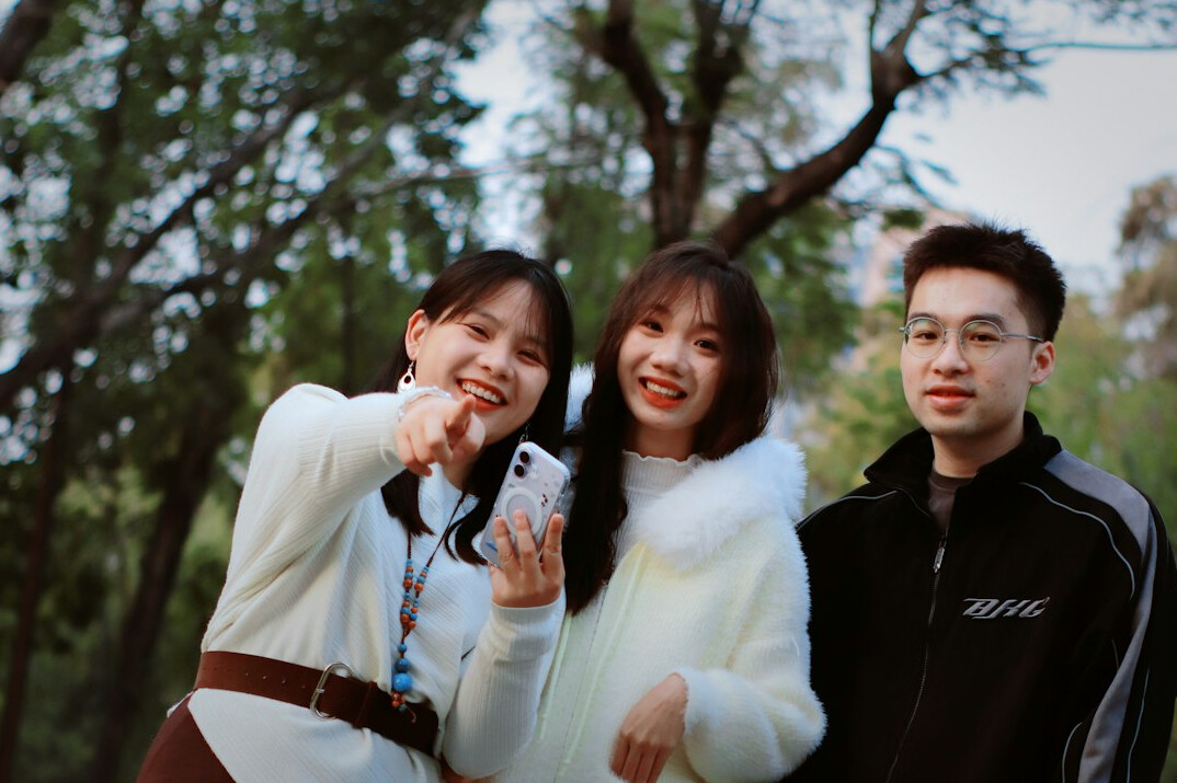 Group of colleagues smiling together outdoors