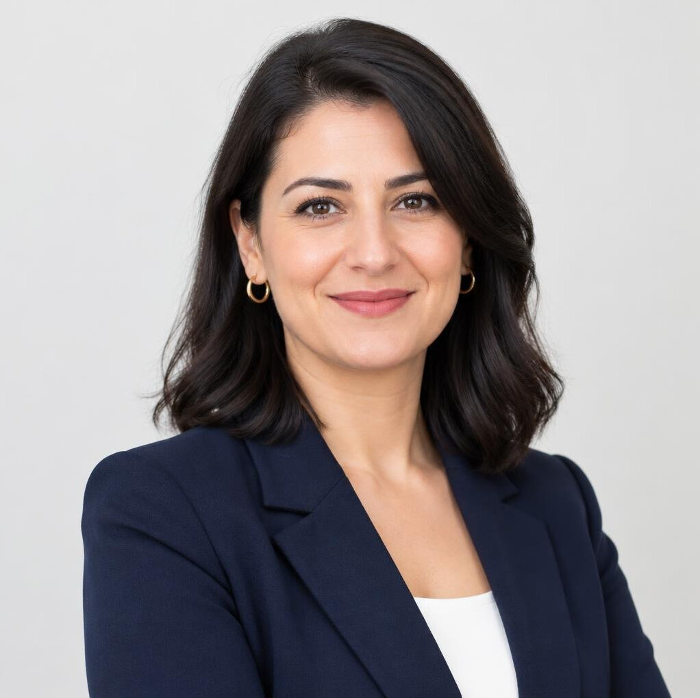 Professional portrait of a businesswoman with dark hair
